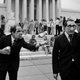 Two demonstrators wearing a President Nixon mask and a Henry Kissinger mask give a Nazi salute in front of the Supreme Court building on July 24, 1974 (AP Photo/John Duricka)